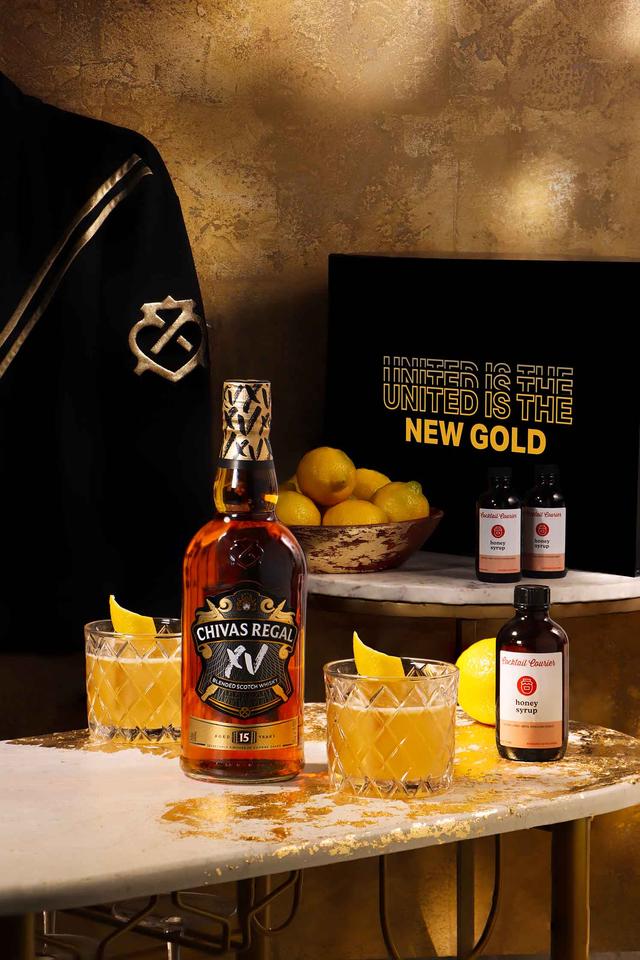 Golden Hour Glow Up Cocktail Courier kit featuring a bottle of Chivas Whisky
